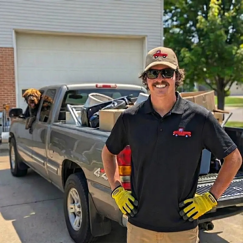 Sawyer Bauman, founder of Grime To Dime, with his truck and dog in Howard County