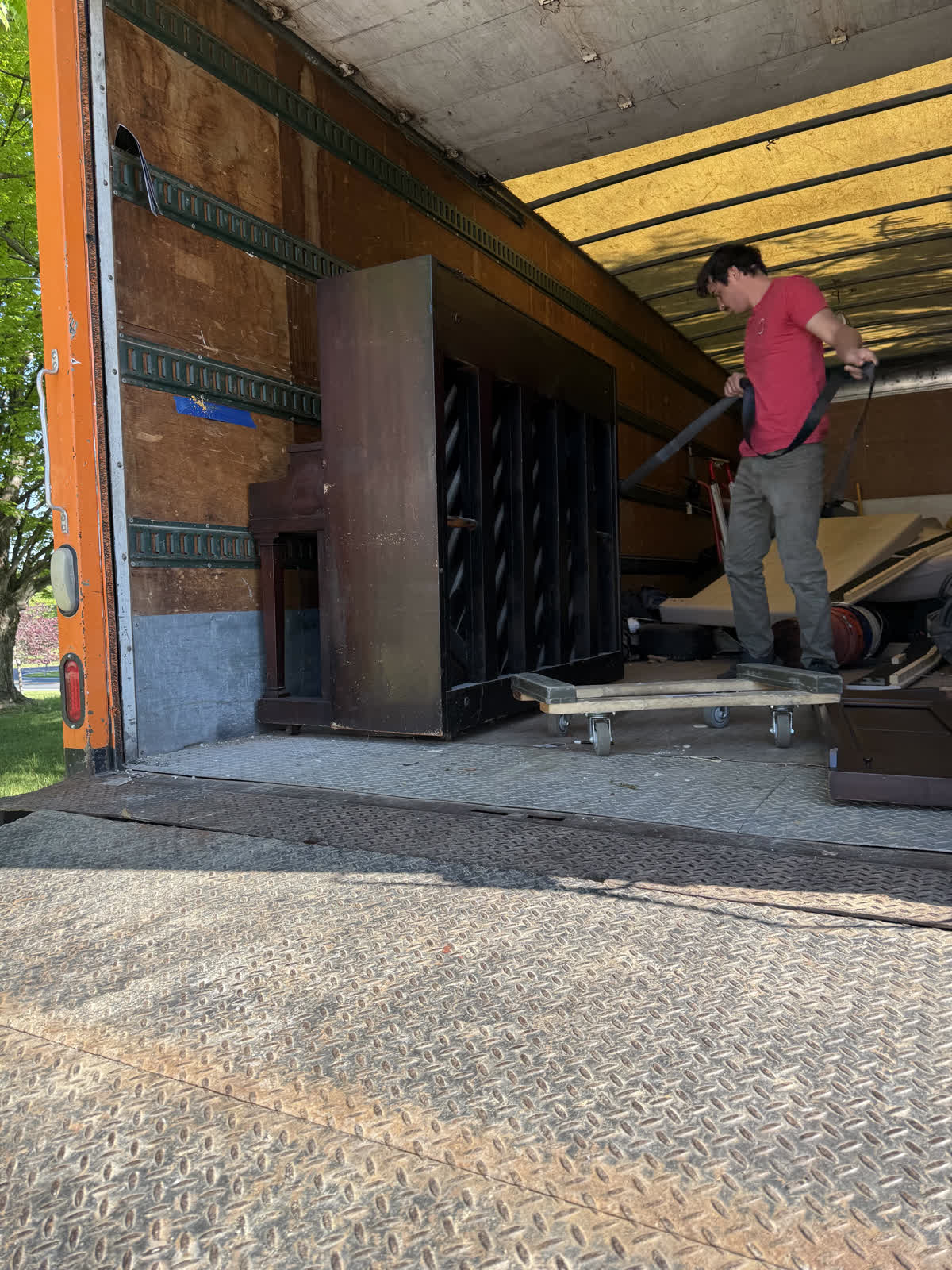 Grime To Dime crew hauling a piano from a Howard County driveway