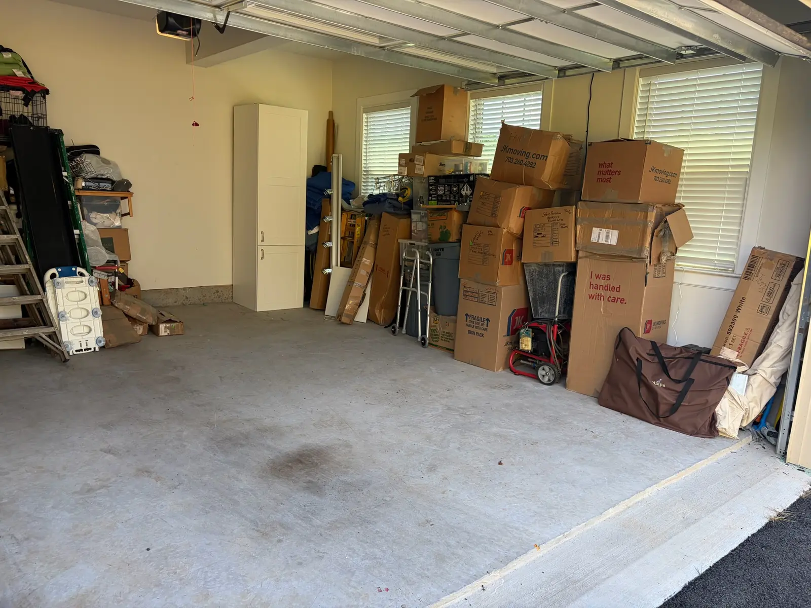 Fulton Maryland garage after organizing with retained boxes consolidated and open floor space restored